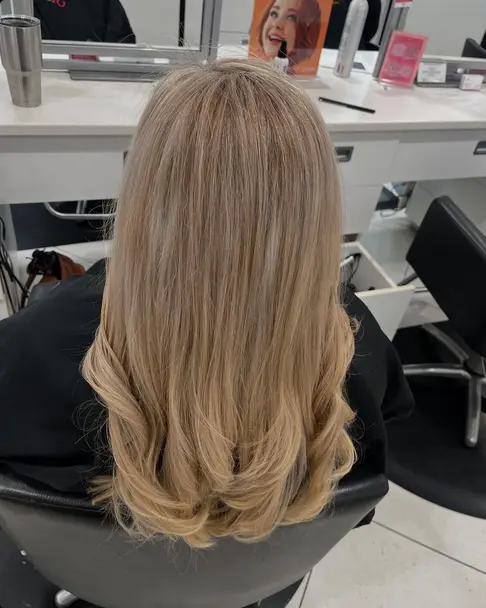 Vibrant copper hair coloring with smooth styling