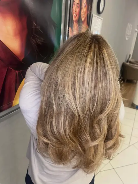 Textured shag cut with face-framing curtain bangs